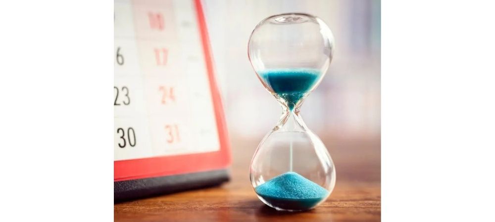 hourglass with blue sand